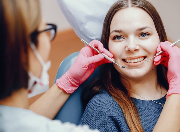 Dentist examining patient in Oak Harbor dental office