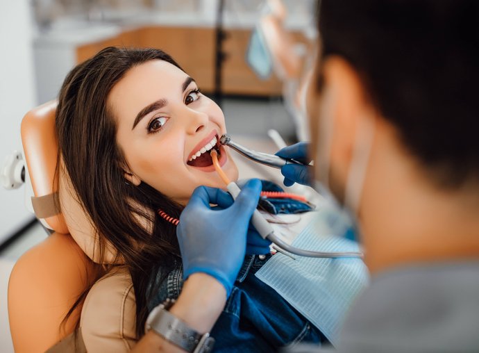 Dental patient smiling after cosmetic treatment in Oak Harbor