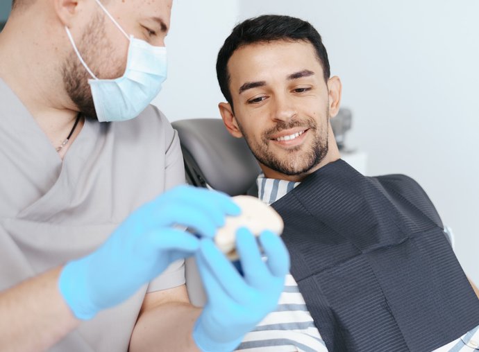 Dental patient smiling after cosmetic treatment in Oak Harbor