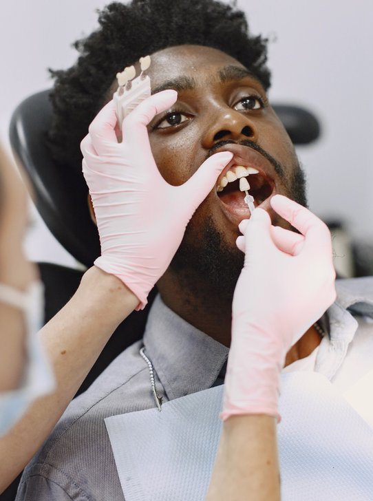 Dentist fitting custom dental appliance for patient in Oak Harbor
